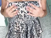 Horny wife squeezing her boobs in leopard dress