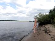 Exhibitionist Blonde Goes Nude on a River Beach