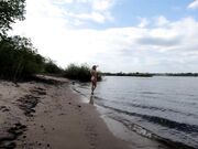 Exhibitionist Blonde Goes Nude on a River Beach