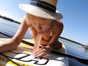 Blonde MILF Plays with Dildo and Gives Blowjob on a SUP Board