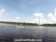 Big-Ass Blonde Rides a SUP Board Naked on a Beach