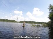 Big-Ass Blonde Rides a SUP Board Naked on a Beach