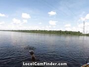 Big-Ass Blonde Rides a SUP Board Naked on a Beach